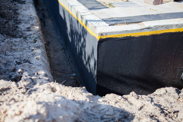 Professional Basement Waterproofing technician working in Custer, WI